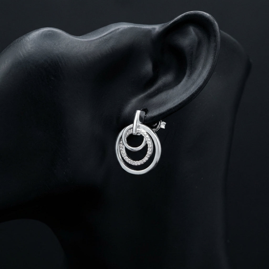 1/5 CTW Natural Diamond Earrings in Sterling Silver displayed on ear - GOLDZENN