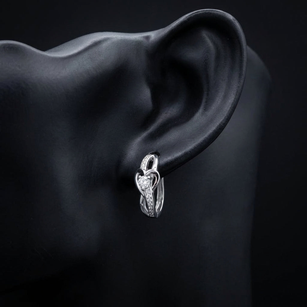 1/12 CTW Natural Diamond Heart Hoop Earrings displayed on ear - GOLDZENN