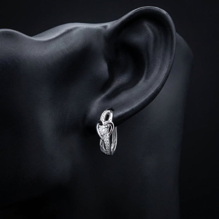 1/12 CTW Natural Diamond Heart Hoop Earrings displayed on ear - GOLDZENN