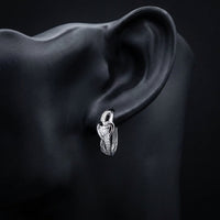 1/12 CTW Natural Diamond Heart Hoop Earrings displayed on ear - GOLDZENN