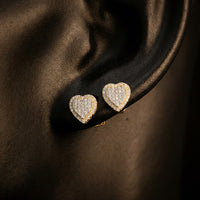 3/8CTW Diamond Heart Earrings 10K Yellow Gold displayed on ear - GOLDZENN