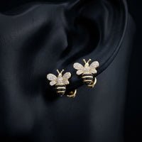 Black Diamond Honey Bee Earrings in 10K Yellow Gold displayed on ear - GOLDZENN