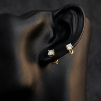 10k Yellow Gold Diamond Stud Earrings 1/20 Cttw displayed on ear - GOLDZENN