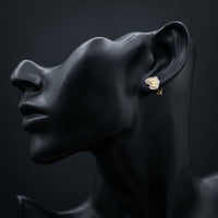 10k Yellow Gold Round Diamond Nugget Earrings 1/10 Cttw displayed on ear - GOLDZENN