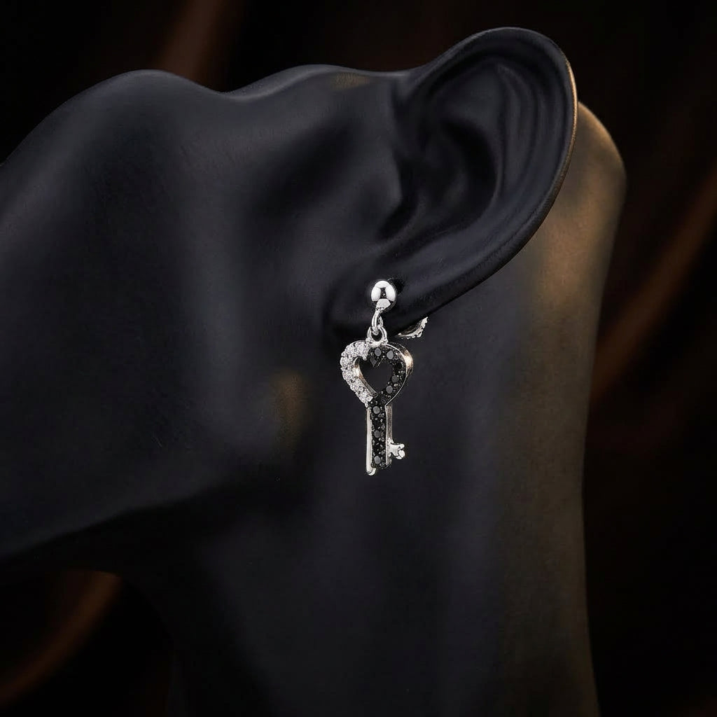 10k White Gold Black Diamond Key Heart Earrings displayed on ear - GOLDZENN