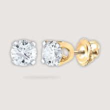  3/4CTW Round Diamond Solitaire Stud Earrings - 14K Yellow GoldElevate your elegance with 3/4CTW diamond solitaire earrings in 14K yellow gold. Perfect for any occasion, these diamonds add timeless glamour.