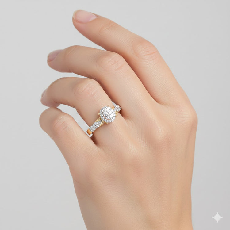 A hand with neatly manicured nails wears the 1/4CTW Diamond Oval Halo Engagement Ring, crafted in 10K gold and featuring an oval center stone encircled by a shimmering diamond halo on a sparkling band.