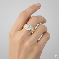 A hand wearing the 10k Gold Round Diamond Cluster Bridal Ring (1/2 Cttw) on the ring finger is shown against a plain light gray background.