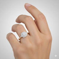 A hand with a natural nude manicure wears the 1/4 CTW Diamond Double Halo Engagement Ring on the ring finger, showcasing sparkling diamonds set in a double halo design against a light gray background.