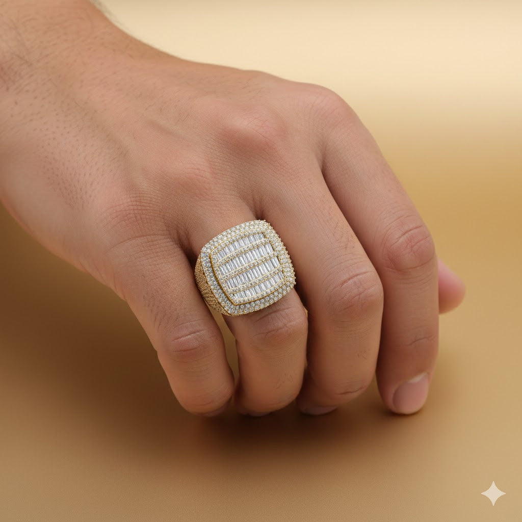A hand showcases the Cushion Baguette Diamond Ring – 6.07 CT Gold Design, featuring a large rectangular gold setting with rows of diamonds, set against a smooth light tan background.