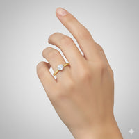 A hand wearing the 14k Yellow Gold Diamond Solitaire Bridal Ring 3/8 Cttw on the ring finger is displayed against a plain, light gray background.