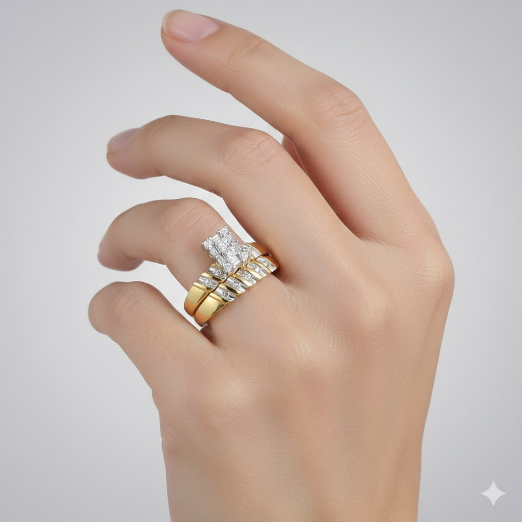 A hand with manicured nails displays the 10k Yellow Gold Diamond Cluster Wedding Ring Set, featuring sparkling diamonds and stacked rings, set against a simple light background.