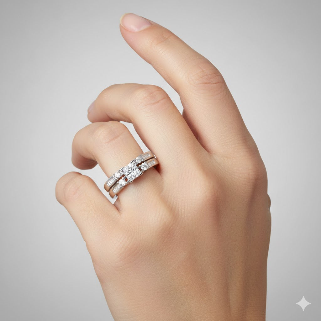 A light-skinned hand displays the 10k White Gold Princess Diamond Bridal Ring Set 3/8 Cttw on the ring finger, featuring a princess diamond wedding ring with side stones and a matching band against a plain light background.