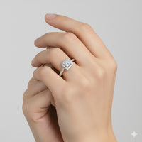 A close-up of a hand wearing the 10k Gold Princess Diamond Halo Engagement Ring, featuring a square-shaped center stone and diamond-studded band, set against a plain light background.