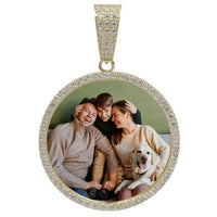 The 10k Solid Gold Picture Pendant with CZ Stones displays a smiling man, woman, child, and white dog together on a couch, framed by sparkling stones for an elegant touch.