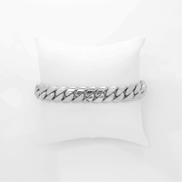 A 12mm Handmade Miami Cuban Link Bracelet in 10K/14K/18K solid gold is displayed on a white cushion against a plain white background.