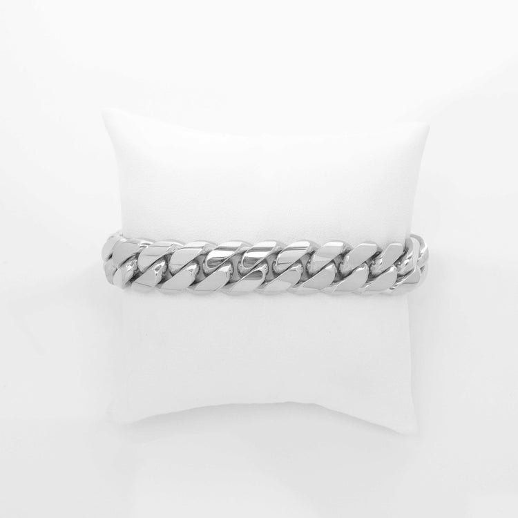 A 14mm Handmade Miami Cuban Link Bracelet in 10K/14K solid gold is displayed on a white cushion, photographed against a plain white background.