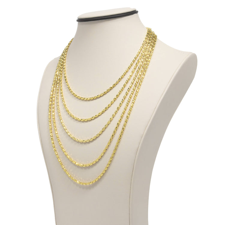A display bust features the 3mm Barrel Crystal Chain, a 14K gold bonded necklace with multiple layered strands in varying lengths, each elegantly draped and accented with sparkling crystals.