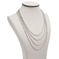 A white jewelry bust showcases a 3mm Barrel Crystal Chain necklace crafted in 925 silver, layered with five strands of varying lengths for an elegant and sparkling style.