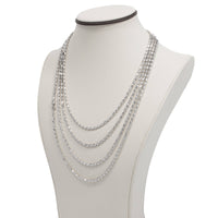 The 3mm Barrel Crystal Chain showcases 925 silver with five graduated strands for a layered look, beautifully displayed on a white jewelry bust.