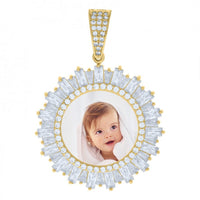 The Baguette Photo Frame Charm Pendant in 10k Solid Gold features a circular, diamond-studded design with a custom image of a smiling baby with brown hair wrapped in a white towel on a plain white background.