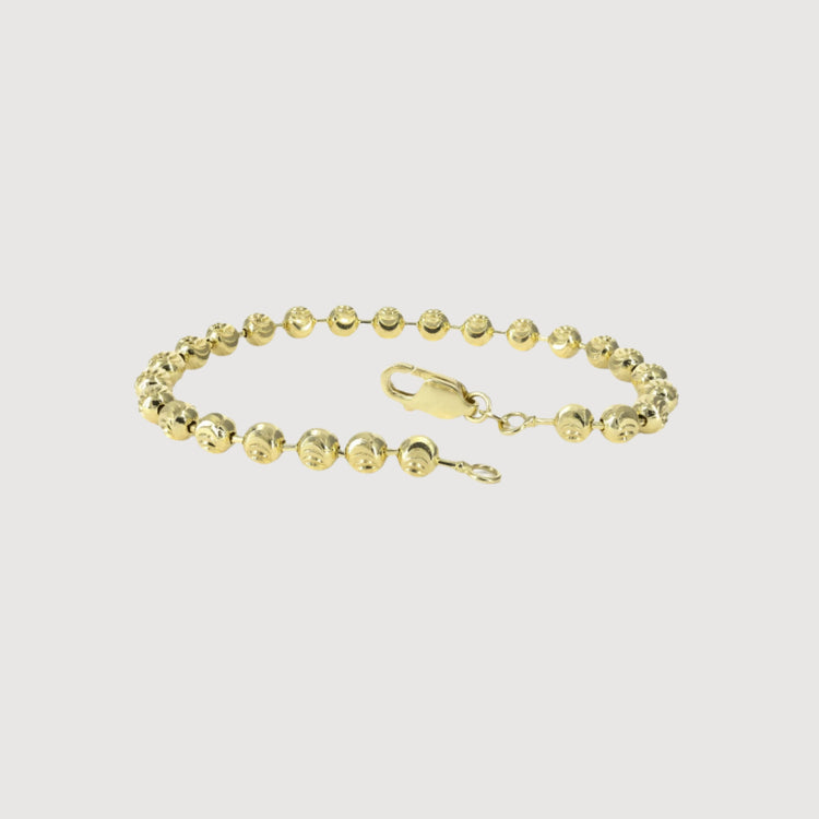 The Bead Bracelet - 5mm Moon Cut features solid 14K yellow gold moon cut beads with a lobster clasp, showcased on a plain white background.
