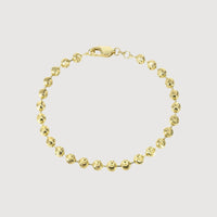 The Bead Bracelet - 5mm Moon Cut is a delicate 14K solid yellow gold piece with round, textured 5mm moon-cut beads linked together and finished with a lobster clasp, shown against a plain white background.