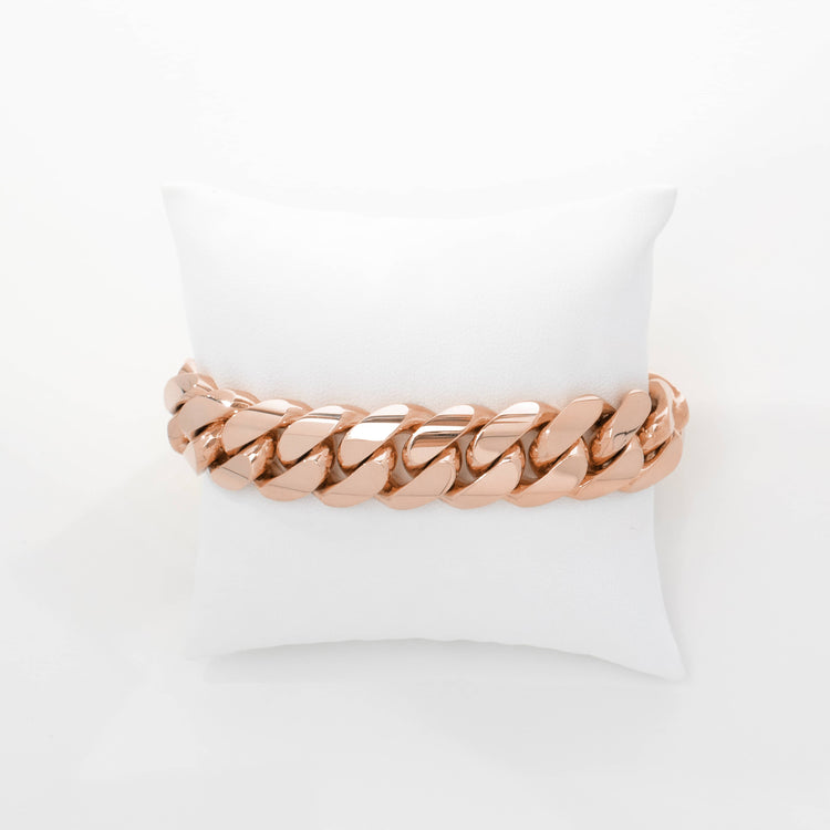 The 17mm Handmade Miami Cuban Link Bracelet in 10K/14K solid gold is displayed on a white cushion against a plain white background.