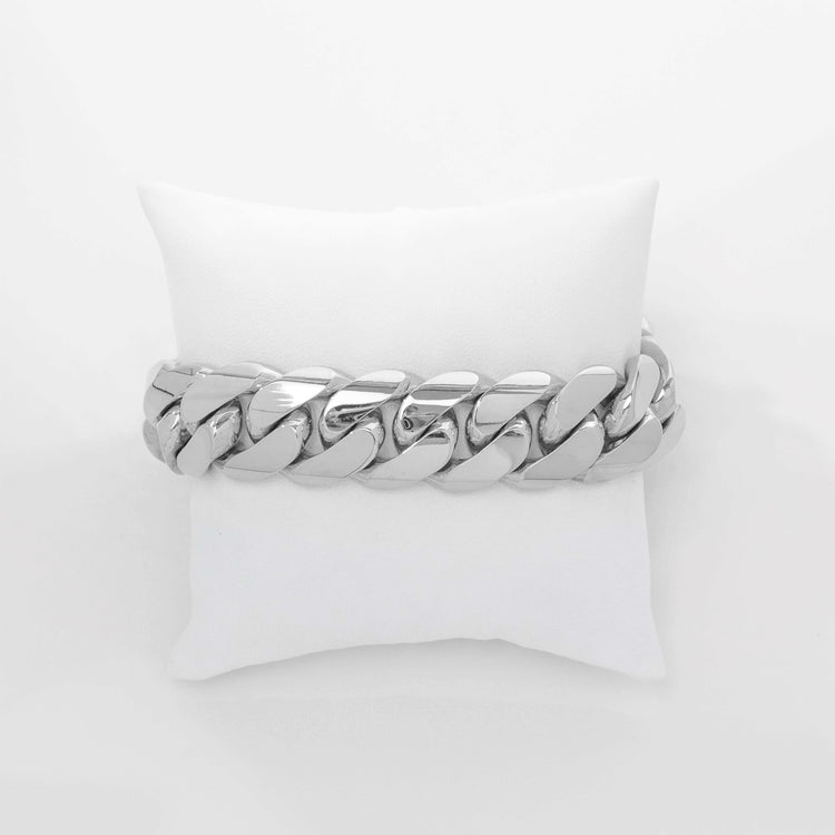 The 19mm Handmade Miami Cuban Link Bracelet in 10K/14K solid gold is displayed on a white cushion against a plain white background.