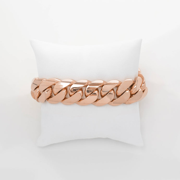 The 19mm Handmade Miami Cuban Link Bracelet in 10K/14K solid gold is displayed on a white cushion against a plain white background.
