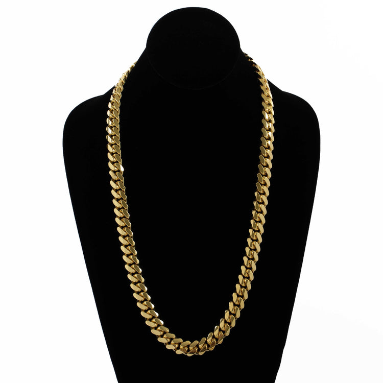 The Cuban Link Chain 12mm - 14k Gold Bonded is shown on a black velvet mannequin bust, set against a white background.