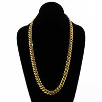 The Cuban Link Chain 12mm - 14k Gold Bonded is shown on a black velvet mannequin bust, set against a white background.