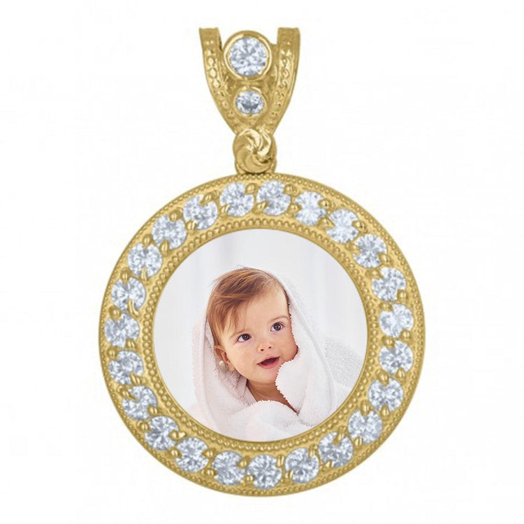 The Custom 10k Solid Gold Picture Pendant with CZ Stones showcases a personalized image of a smiling baby wrapped in a white towel, set in round gold and encrusted with clear CZs. It includes a decorative bail for your favorite necklace.