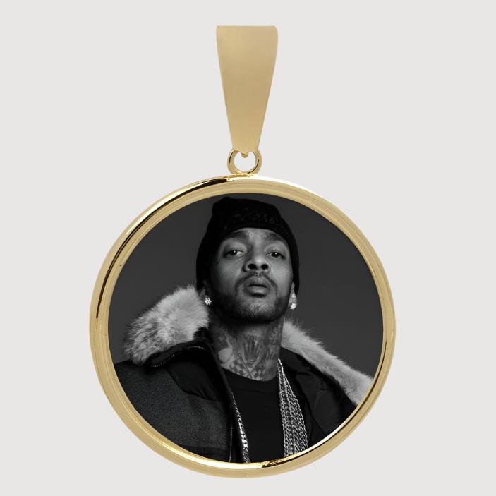 The 10k Solid Gold Picture Pendant is a customizable medallion featuring a black-and-white photo of a man in a fur-collared coat, chains, and beanie.