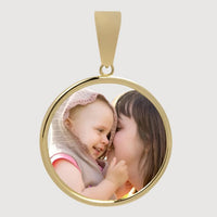 The 10k Solid Gold Picture Pendant - Customizable Medallion displays a cherished photo of a smiling hooded child and an adult woman sharing an affectionate nose-to-cheek moment.