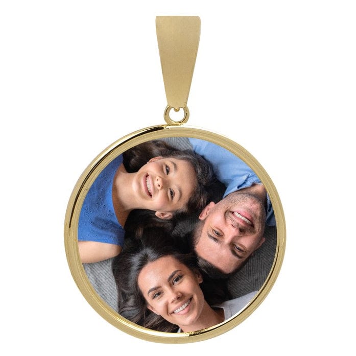 The 10k Solid Gold Picture Pendant - Customizable Medallion displays a photo of three smiling people—a girl, woman, and man—lying close together on their backs with heads touching and looking up at the camera.