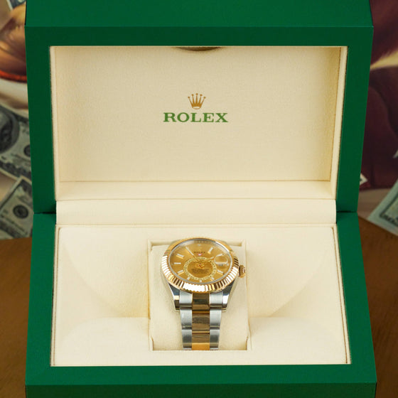 Rolex Sky-Dweller 42mm - 326933 - Champagne Dial Gold Steel Oyster Band| Showing the watch detail in a box.
