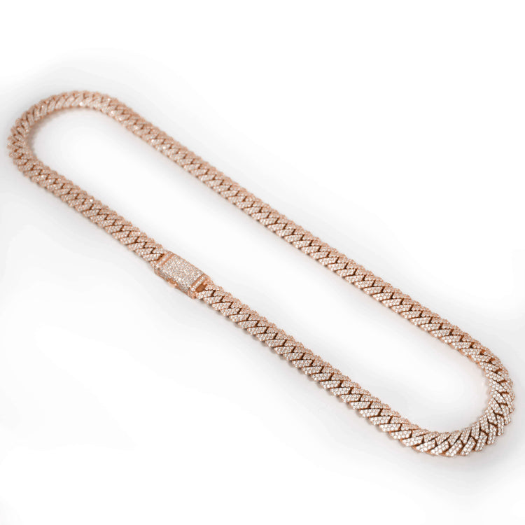 A solid rose gold Diamond Cuban Link Chain (8mm-17.5mm) with a tightly woven, textured design and a sparkling diamond-encrusted clasp, displayed in an oval shape on a white background.