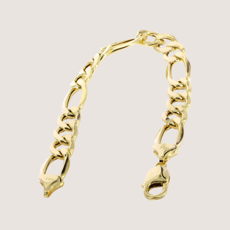The Gold Figaro Bracelet - 6.5 mm features large, interlocking flat oval links and a lobster claw clasp in classic Italian design, crafted from 14k gold and shown on a light, neutral background.