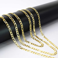Four Figaro Chain 5.5mm - 14k Gold Bonded drape over a matte black cylindrical stand, each men's gold chain displaying repeating long and short links that shine against a white background.