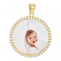 The Medallion Picture Pendant in 10k Solid Gold features glittering gem borders and can be customized with your photo, such as a sweet image of a baby with light brown hair wrapped in a white towel against a soft background.