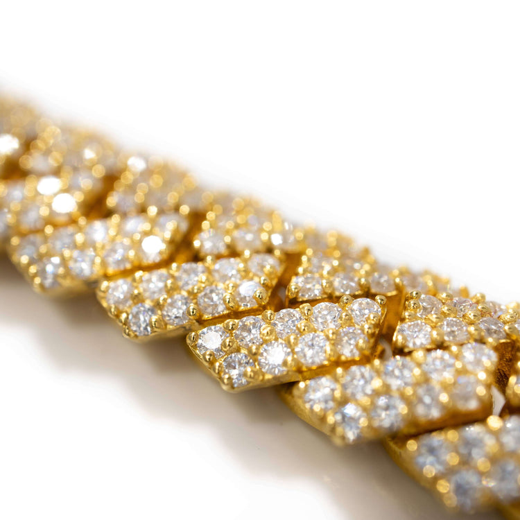 Close-up of the Moissanite Cuban Link Chain 8mm-23mm in solid yellow gold, featuring large interlocking links encrusted with sparkling moissanite stones, shown against a white background.
