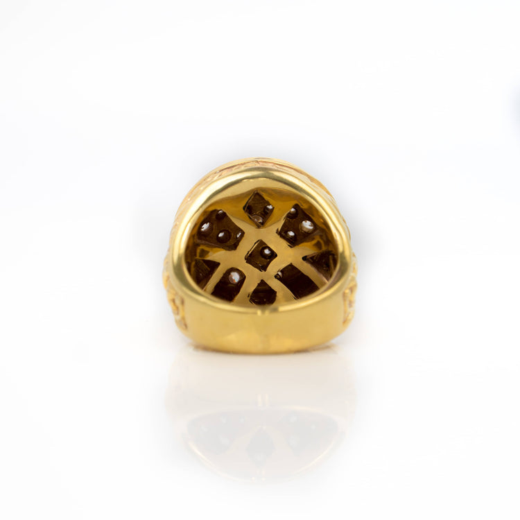 The Round Cluster Ring in Solid Gold is shown from the bottom, featuring an intricate lattice pattern with small round stones set into the design, displayed against a plain white background.