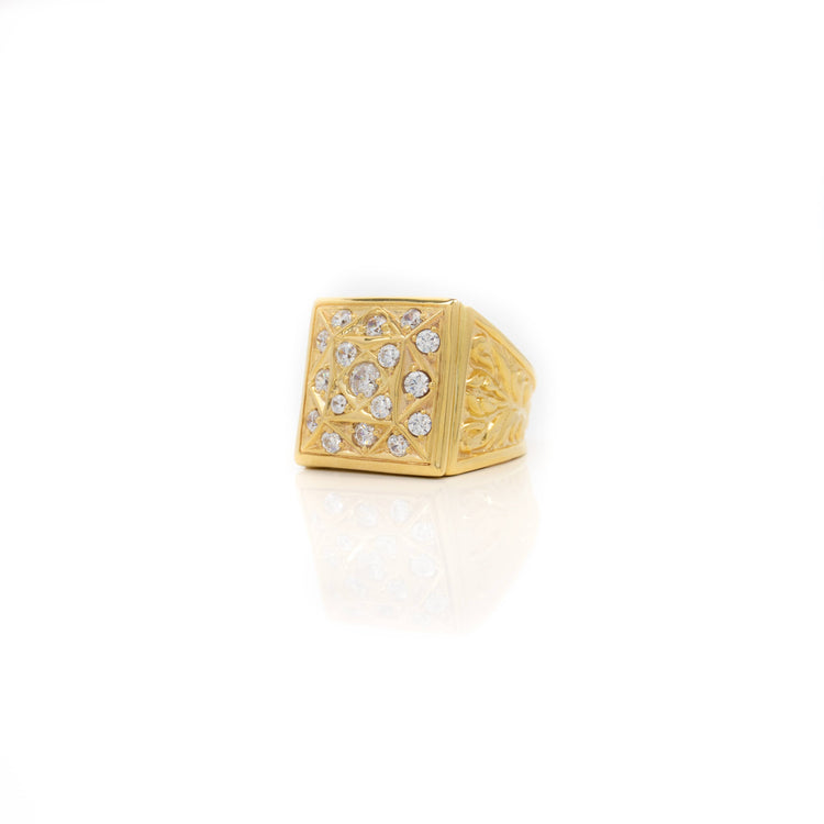 The Square Cluster Ring in Solid Gold features a square face adorned with multiple small round diamonds in a geometric pattern, shown on a white background with a subtle reflection.