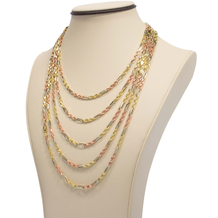 A necklace display bust showcases the Tricolor Milano Figarope Chain—3.5mm 14k solid gold—with alternating gold and rose gold links in a classic multi-strand Figarope design, elegantly layered in loops.