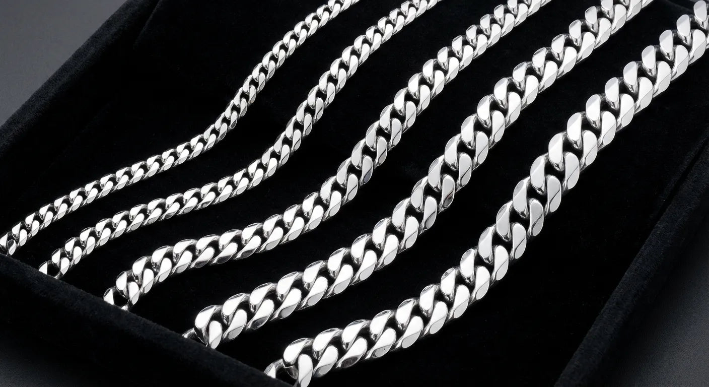GOLDZENN rhodium-plated silver Cuban link chains in multiple widths from 5mm to 20mm displayed on dark velvet showing the brilliant mirror finish