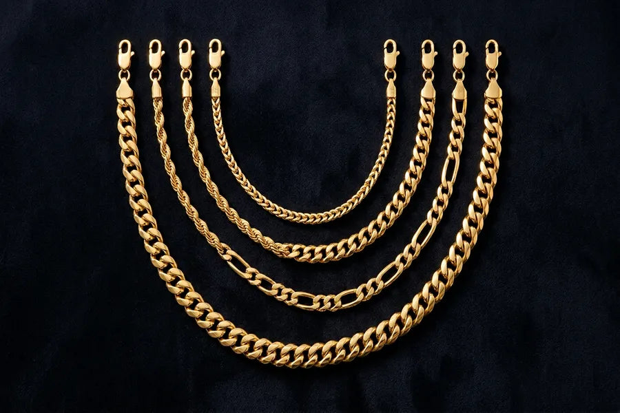 Multiple gold chains in varying lengths from 22 to 30 inches displayed on dark surface showing GOLDZENN length progression
