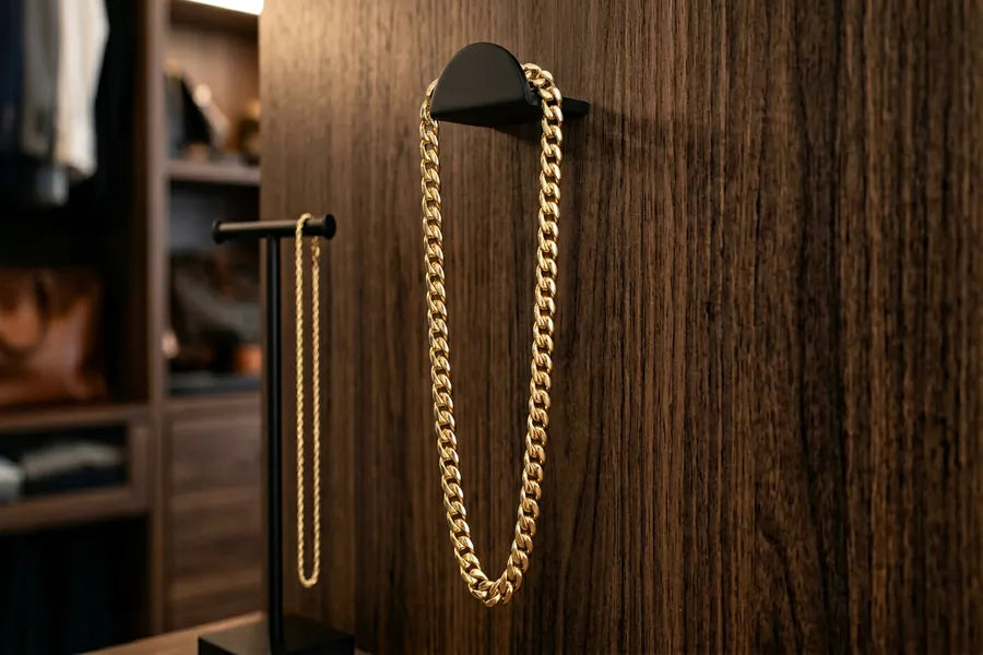 Proper gold chain storage showing chain hanging from a jewelry hook to prevent tangling and kinking