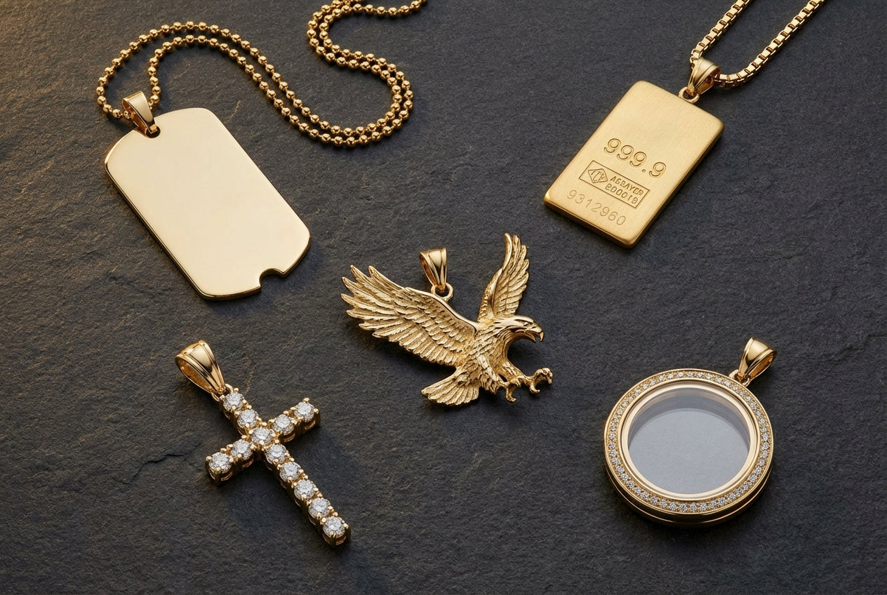 Five styles of men's gold pendants — military dog tag, 24K gold bar, eagle, diamond cross, and picture pendant — arranged on dark stone surface