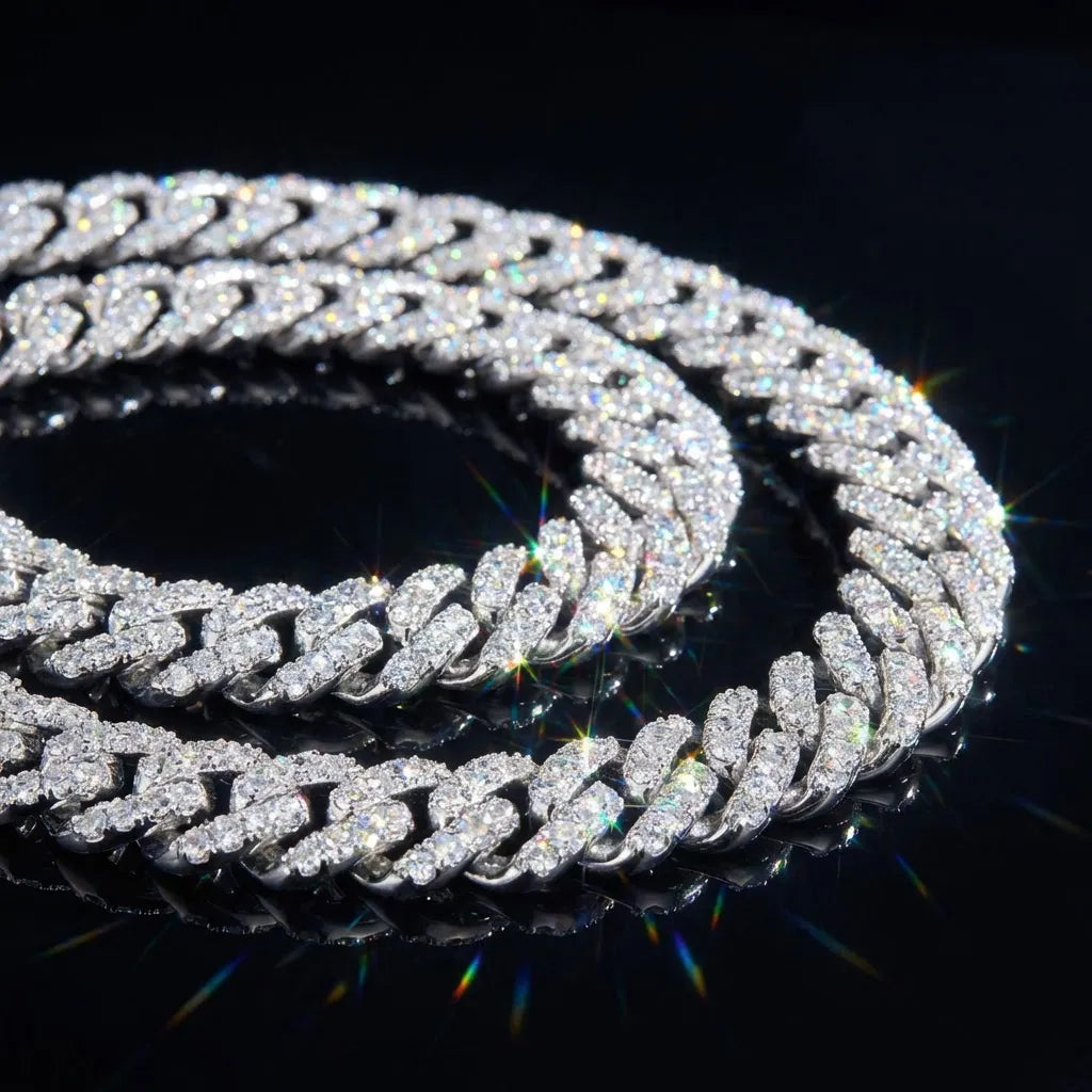 Close-up of a thick iced-out moissanite Cuban link chain in polished 925 sterling silver with brilliant moissanite stones sparkling between every interlocking link, dramatic lighting on dark reflective surface